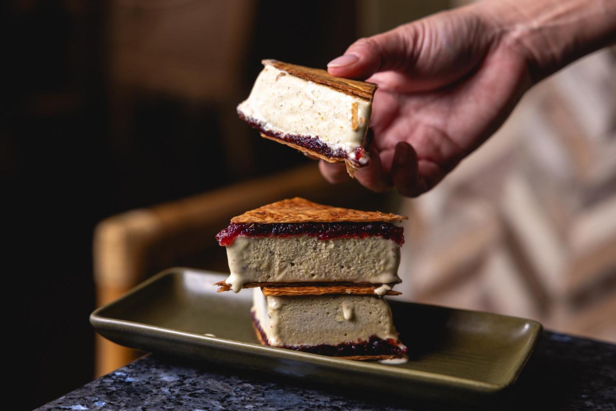 Ovolo The Valley Брисбен Экстерьер фото A hand holding a piece of ice cream sandwich